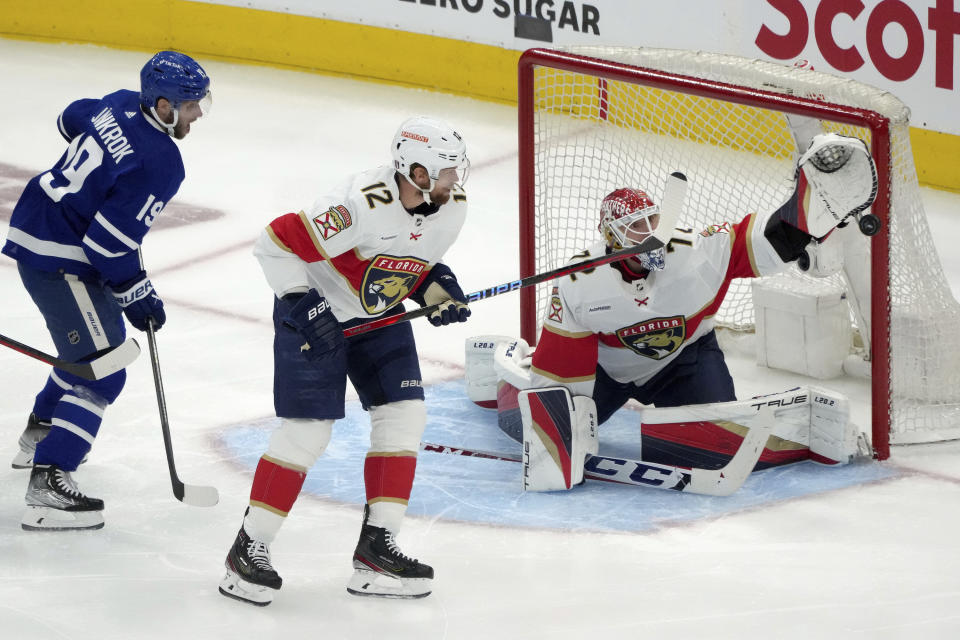 Florida Panthers goaltender Sergei Bobrovsky (72) makes a save on a shot from Toronto Maple Leafs center John Tavares, not shown, as Leafs' Toronto Maple Leafs center Calle Jarnkrok (19) and Florida Panthers center Eric Staal (12) look on during the second period of Game 1 of an NHL hockey Stanley Cup second-round playoff series in Toronto, Tuesday, May 2, 2023. (Chris Young/The Canadian Press via AP)