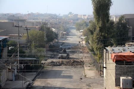 A military vehicle of iraqi security forces is seen in the streets of Mosul during a battle with Islamic State militants, Iraq, November 29, 2016. REUTERS/Stringer