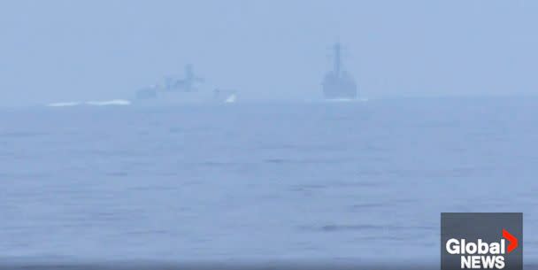 PHOTO: A Chinese warship appears to have intercepted the pair of U.S. and Canadian ships transiting through the Taiwan Strait overnight. (Global News)