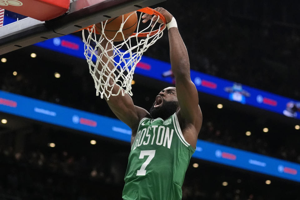 Boston Celtics guard Jaylen Brown dunks the ball during the first half of Game 5 of the NBA basketball finals against the Dallas Mavericks, Monday, June 17, 2024, in Boston. (AP Photo/Charles Krupa)