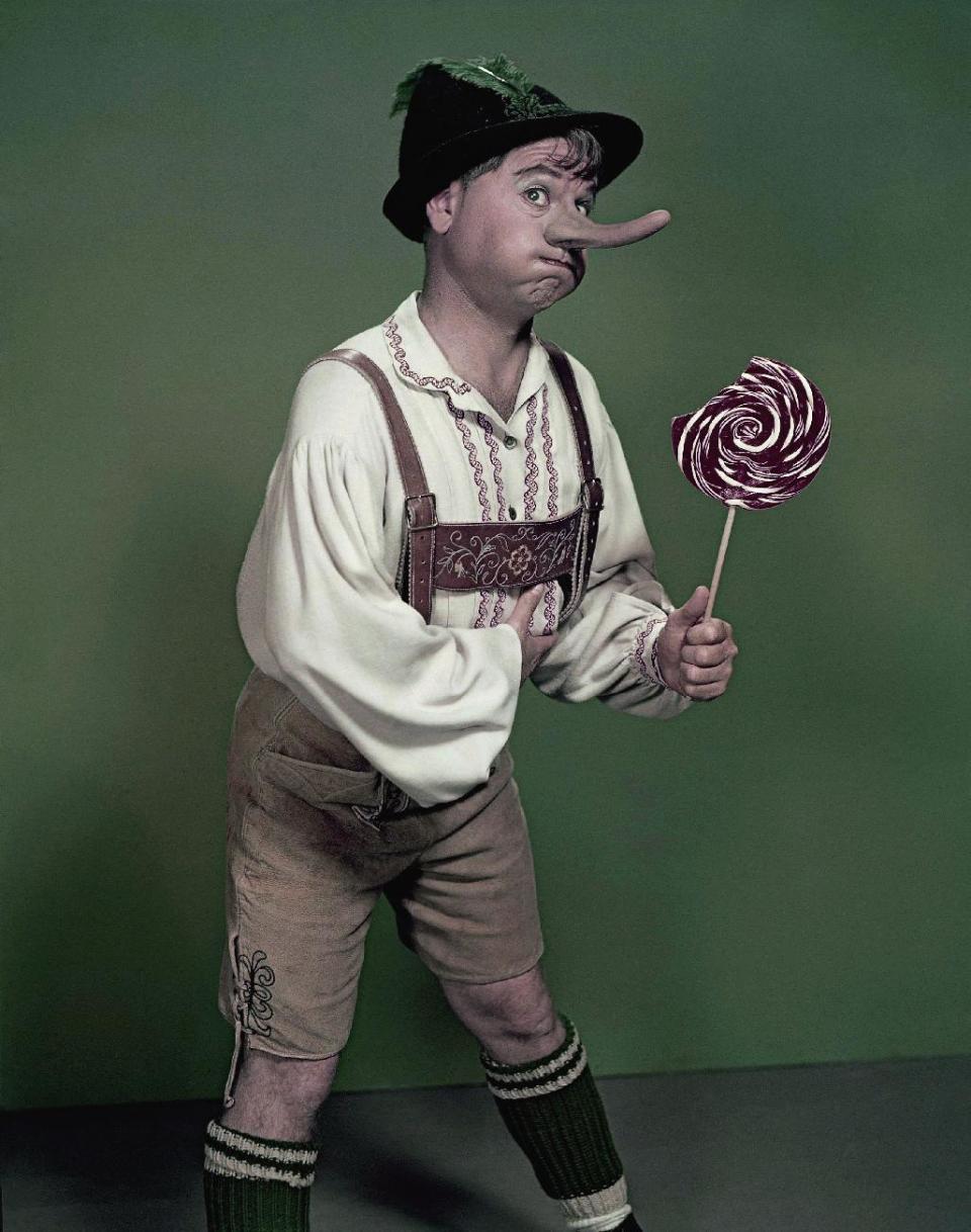 FILE - Actor Mickey Rooney portrays "Pinnochio," in this September 1957, file photo. Rooney, a Hollywood legend whose career spanned more than 80 years, has died. He was 93. Los Angeles Police Commander Andrew Smith said that Rooney was with his family when he died Sunday, April 6, 2014, at his North Hollywood home. (AP Photo/File)