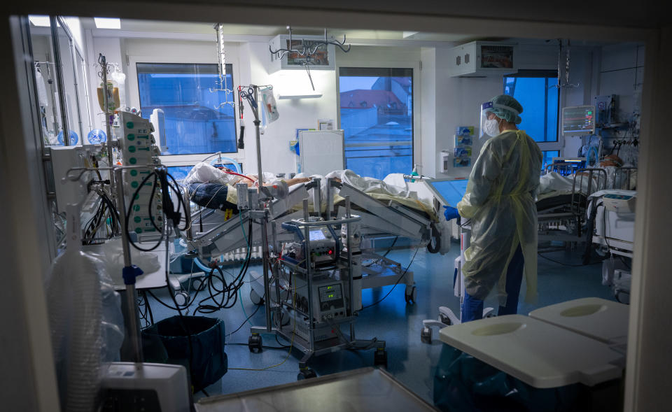 A patient receives medical care from a specialist in the Covid-19 intensive care unit at the Rechts der Isar hospital in Germany.