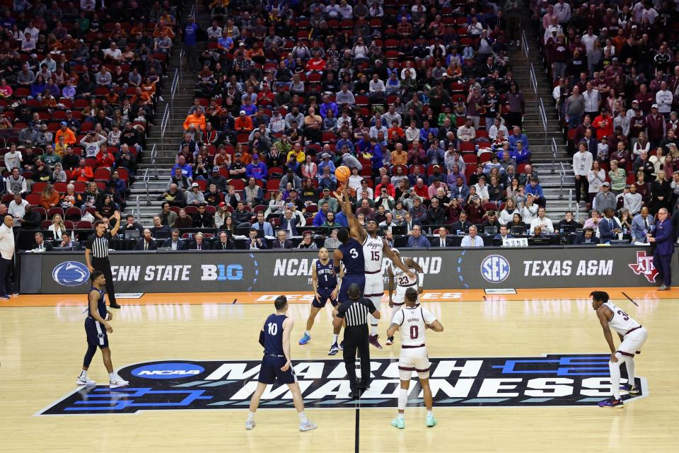 Penn State Nittany Lions forward Kebba Njie (3) and Texas A&M Aggies forward Henry Coleman III (15) reach for the opening tip-off during the first half at Wells Fargo Arena.