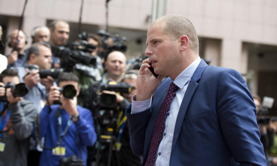 FILE - In this Monday, Sept. 14, 2015 file photo, Belgium's State Secretatry for Asylum Policy and Migration Theo Francken arrives for a meeting of EU justice and interior ministers at the EU Council building in Brussels. Belgian migration minister Theo Francken on Thursday, Dec. 6, 2018 said he wants no part of a United Nations pact on safe and orderly migration, an international deal that has pushed Belgium's government to the brink of collapse. (AP Photo/Virginia Mayo, File)