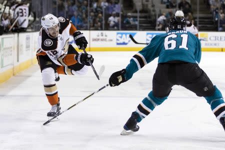 Nov 20, 2017; San Jose, CA, USA; Anaheim Ducks center Logan Shaw (48) shoots past San Jose Sharks defenseman Justin Braun (61) in the first period at SAP Center at San Jose. John Hefti-USA TODAY Sports