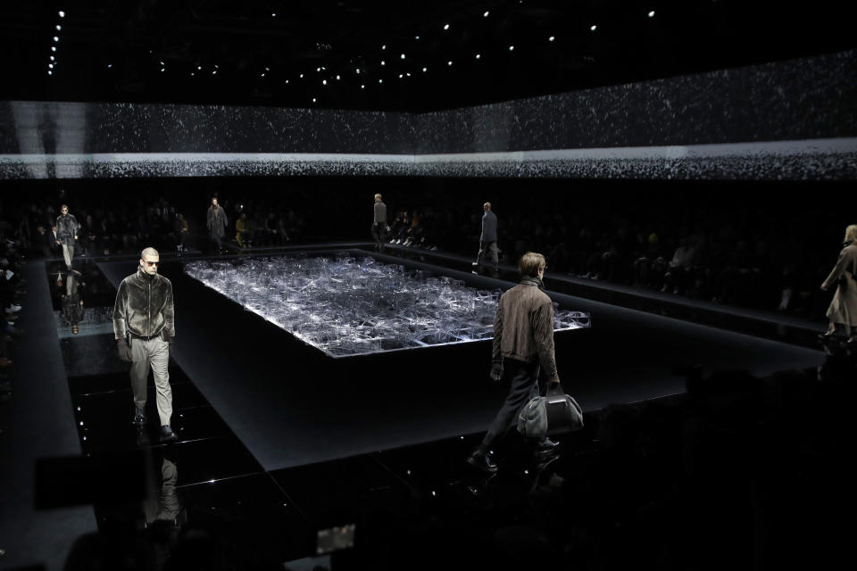 Models wear creations as part of the Armani men's Fall-Winter 2020/21 collection, that was presented in Milan, Italy, Monday, Jan. 13, 2020. (AP Photo/Luca Bruno)