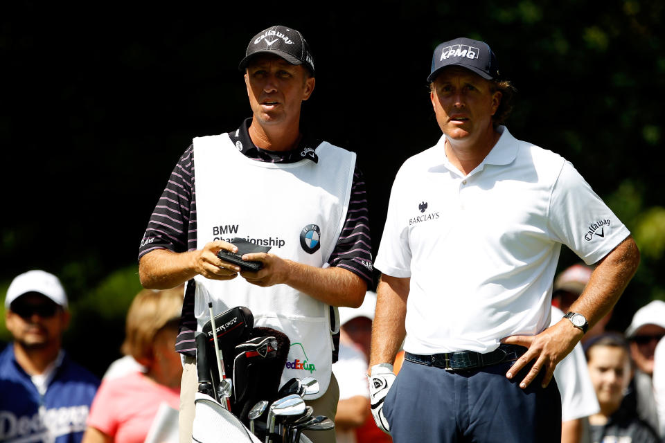 CARMEL, IN - SEPTEMBER 08: Phil Mickelson (R) and his caddie Jim MacKay look on from the second hole tee box during the third round of the BMW Championship at Crooked Stick Golf Club on September 8, 2012 in Carmel, Indiana. (Photo by Chris Chambers/Getty Images)