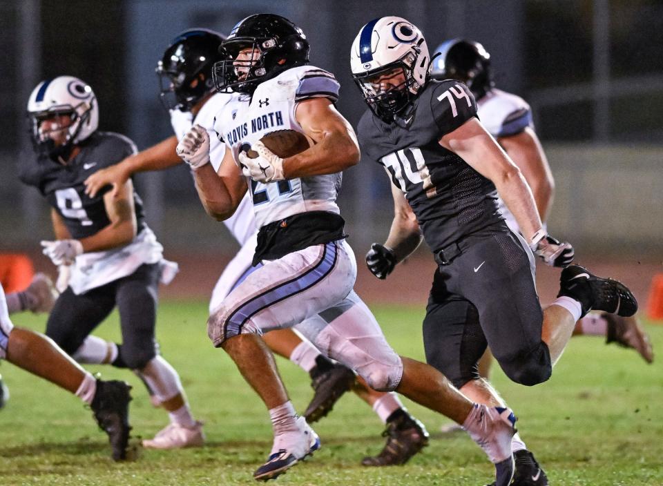 Clovis North's Jackson Cinfel runs against Central Valley Christian in a non-league high school football game Friday, September 8, 2023.