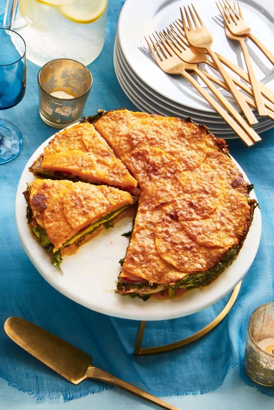 <p>For all of your vegetarian guests (and even those who aren't!), whip up this torte filled with squash, kale, potato and tomato. </p><p><em><a href="https://www.goodhousekeeping.com/food-recipes/a37339130/vegetable-torte-recipe/" rel="nofollow noopener" target="_blank" data-ylk="slk:Get the recipe for Vegetable Torte »;elm:context_link;itc:0;sec:content-canvas" class="link ">Get the recipe for Vegetable Torte »</a></em> </p>