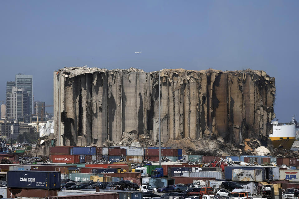 General view of grain silos at Beirut port, Lebanon, Friday, July 22, 2022. The latest fire at the silos’ damaged north block, right part, was due to fermenting wheat and grains still trapped inside the building, outgoing Economy Minister Amin Salam told reporters. On Aug. 4, 2020, hundreds of tons of ammonium nitrate, a highly explosive material used in fertilizers that had been improperly stored for years in the giant silos exploded. (AP Photo/Hassan Ammar)