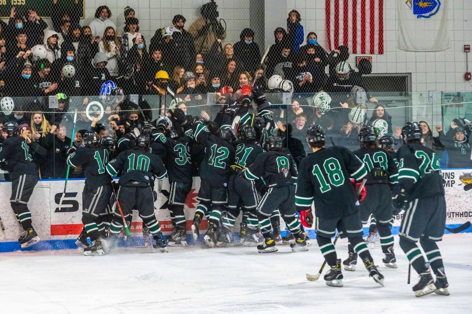 The Dartmouth hockey team heads to their fans following their victory over Bishop Stang in the Spartan Cup.