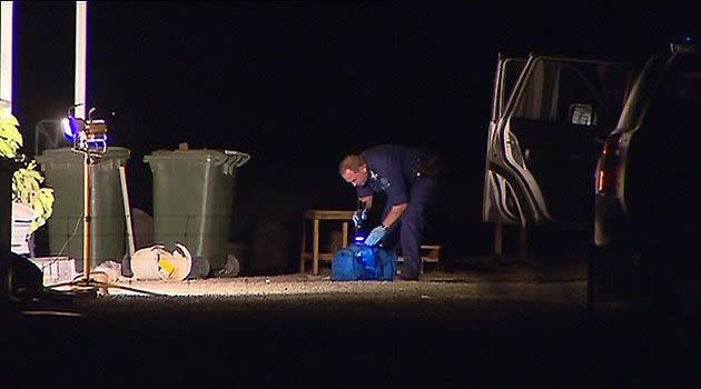 A crime scene investigator at the Kudla house last night.