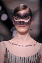 <p>A quote by French poet André Breton was “tattooed” across a model’s chest, which read, <em>“Au départ il ne s’agit pas de comprendre mais bien d’aimer,”</em> which translates to, “Initially, it’s not about understanding, but about loving.” (Photo: Getty) </p>