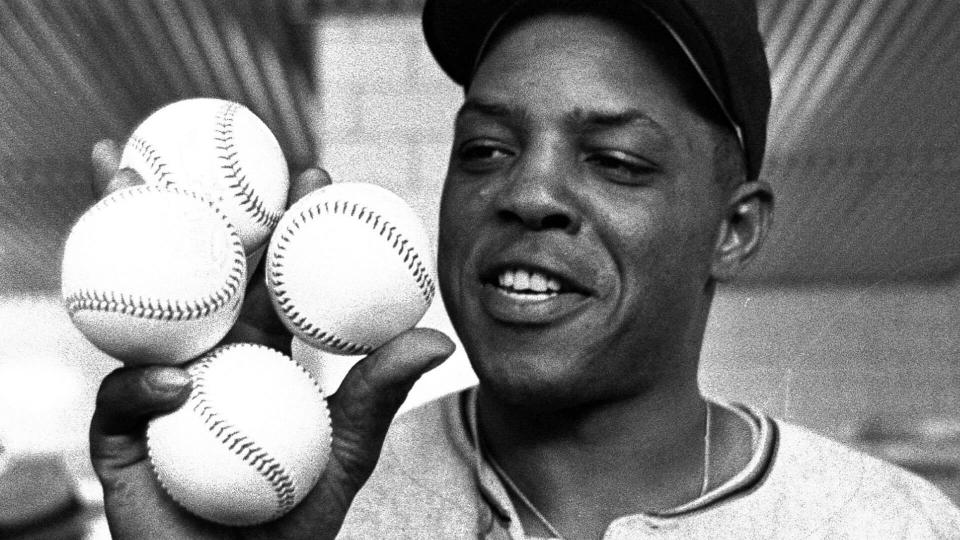 Mandatory Credit: Photo by Dvn/AP/Shutterstock (6620428a)San Francisco Giants star outfielder, Willie Mays, proudly displays the four baseballs in the clubhouse representing the four homers which he hit against the Milwaukee Braves in Milwaukee.