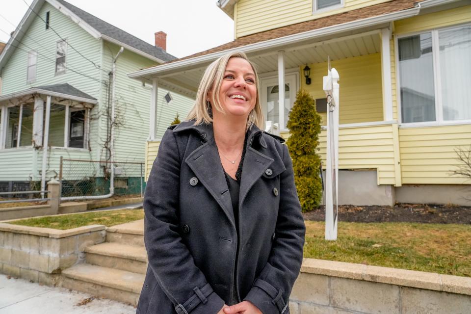 Lisa Guillette, executive director of the nonprofit advocacy group Foster Forward, stands outside an East Providence property that will soon house young people who have aged out of the foster care system.
