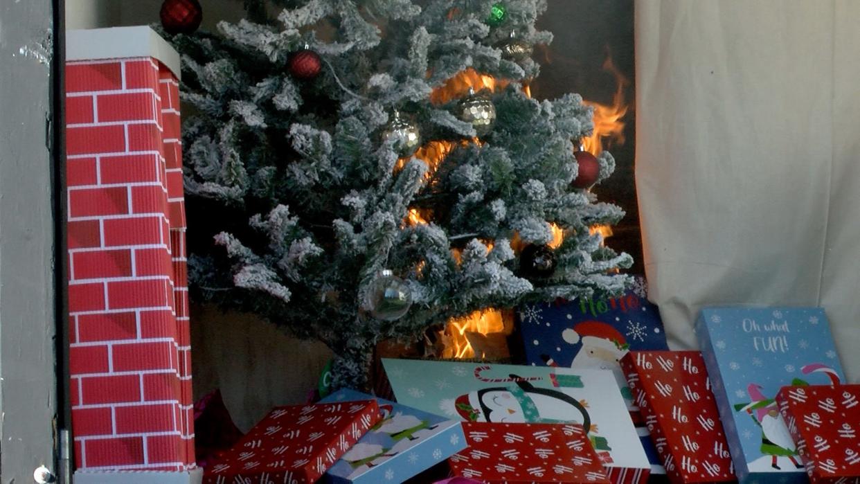 Flames begin to spread in a fire burn demonstration trailer at the Monmouth County Fire Academy Monday, December 5, 2022, after a Christmas tree ignited in a room outfitted with a fire sprinkler.  If not properly watered and cared for, these trees can turn into a major fire hazard. 