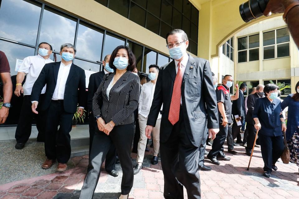 Former Penang chief minister Lim Guan Eng and his wife Betty Chew leaving the Butterworth courthouse August 11, 2020. — Picture by Sayuti Zainudin