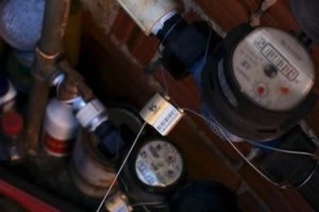 Pressure gauges which measure the pressure of water coming into houses are seen in Brasilandia slum, in Sao Paulo, Brazil, February 11, 2015. REUTERS/Nacho Doce