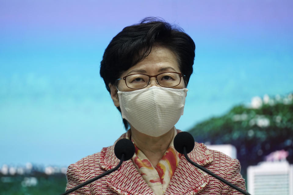 Hong Kong Chief Executive Carrie Lam listens to a reporter's questions during a press conference in Hong Kong, Tuesday, Sept. 22, 2020. Lam said the semi-autonomous Chinese territory has seen its image damaged in the international arena following China’s imposition in June of a sweeping national security law demanding total loyalty to China’s ruling Communist Party. Lam declined to comment directly to reporters on the reasons behind the resignation of an Australian judge on Hong Kong’s top court that has raised the questions about the future of judicial independence in the territory. (AP Photo/Vincent Yu)