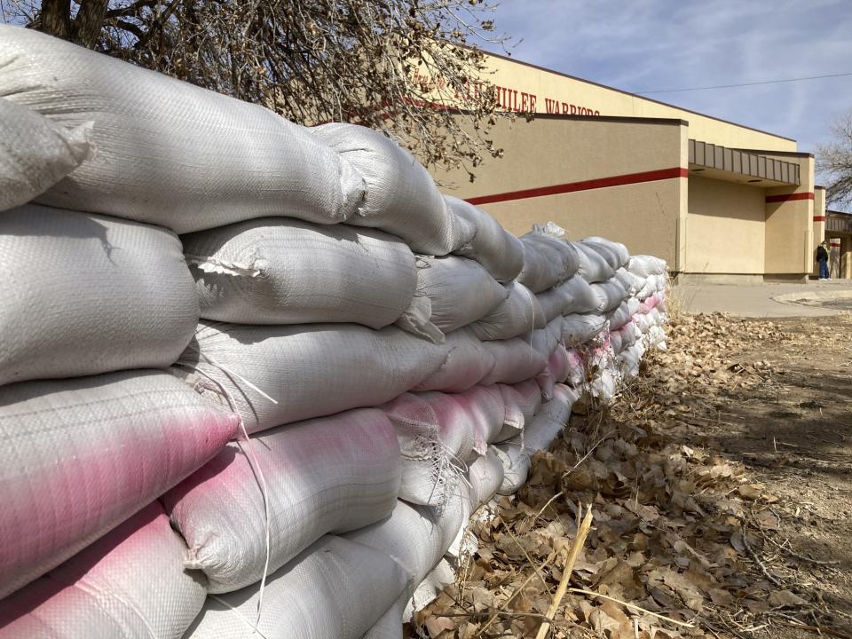 This Feb. 17, 2023 image shows sandbags on school grounds in the Navajo community of To'Hajiilee, New Mexico. To'Hajiilee Community School is just one of dozens funded by the U.S. Bureau of Indian Education that are in desperate need of repair or replacement. The agency estimates it would cost roughly $6.2 billion to address the needs of those schools in poor condition. (AP Photo/Susan Montoya Bryan)