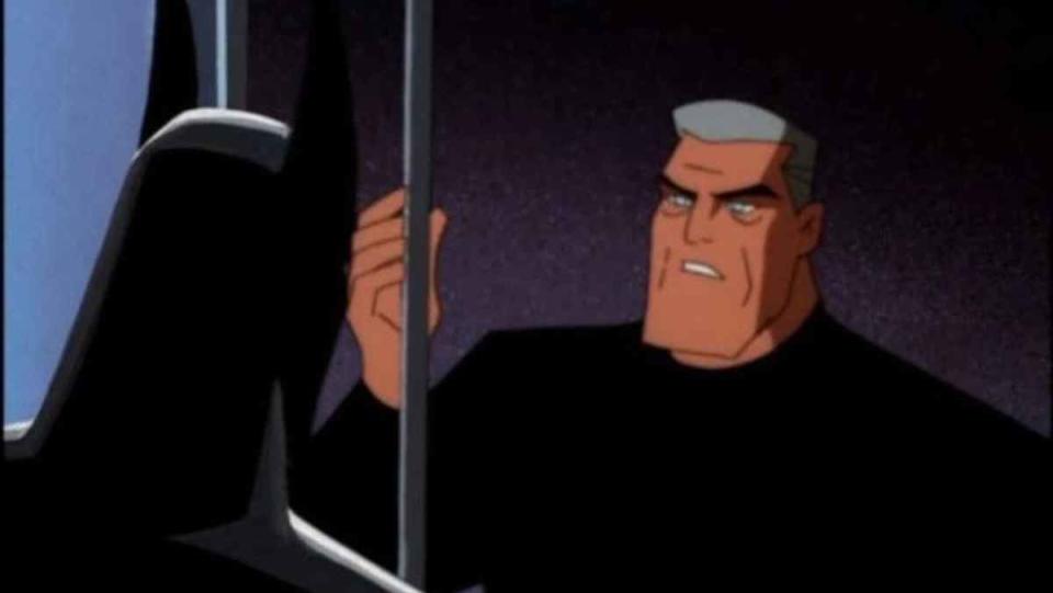 Bruce Wayne stares out the window at Terry in the Batman costume