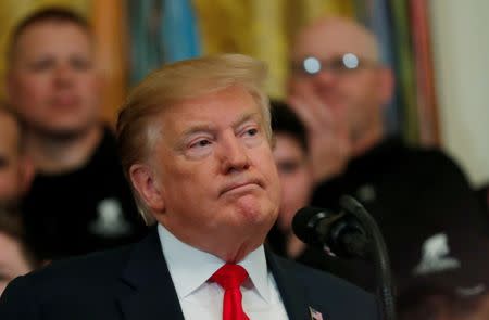 FILE PHOTO: U.S. President Donald Trump reacts as he speaks at the Wounded Warrior Project Soldier Ride event after the release of Special Counsel Robert Mueller's report, in the East Room of the White House in Washington, U.S., April 18, 2019. REUTERS/Carlos Barria/File Photo