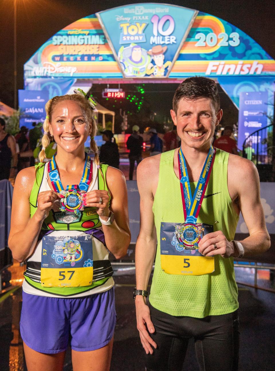 Overall Disney Pixar Toy Story 10-Miler winner Nolan McKenna of the Chicago area poses alongside female winner Emily Wolfarth from the Pittsburgh area following their victorious runs during runDisney Springtime Surprise Weekend on April 16, 2023, in Lake Buena Vista, Fla. This year the event celebrated the magic of Disney Pixar characters and is the final race weekend of the 2022-23 runDisney race season. (Kent Phillips, photographer) 