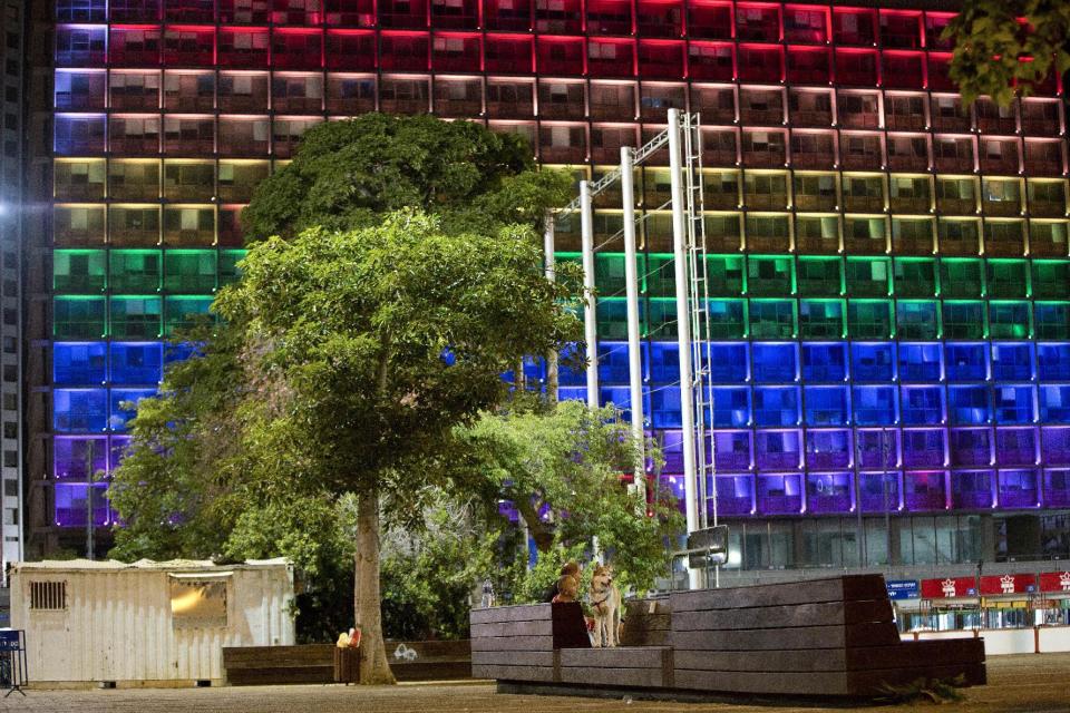 <p>Tel-Aviv city hall lit up with rainbow flag colors in solidarity with Florida’s shooting attack victims, in Tel Aviv, Israel, June 12, 2016. (AP Photo/Oded Balilty) </p>