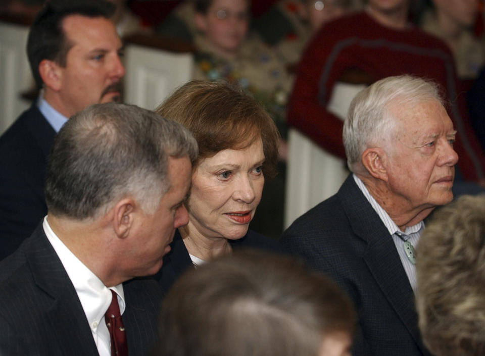 Democratic presidential hopeful former Vermont Gov. Howard Dean, left, attends church services with former President Jimmy Carter, right, and Rosalyn Carter at Maranatha Baptist Church in Plains, Ga., Sunday, Jan. 18, 2004. (AP Photo/John Bazemore)