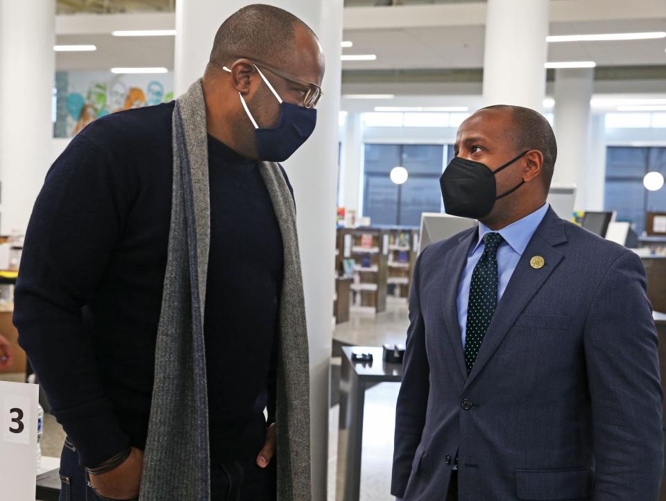 Reggie Moore, left, director of Violence Prevention Policy and Engagement at the Medical College of Wisconsin, talks with Milwaukee Mayor Cavalier Johnson following a news conference where Johnson shared his plans on public safety plans for the city.