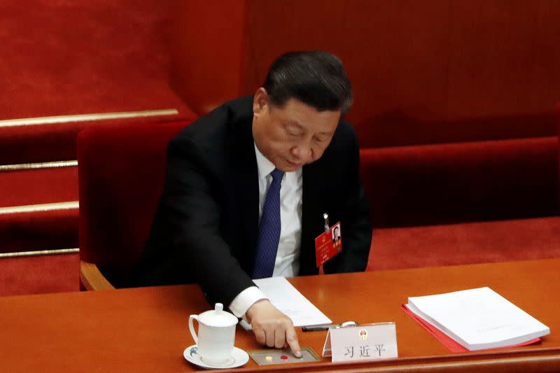 Chinese President Xi Jinping casts his vote on the national security legislation for Hong Kong Special Administrative Region at the closing session of NPC in Beijing