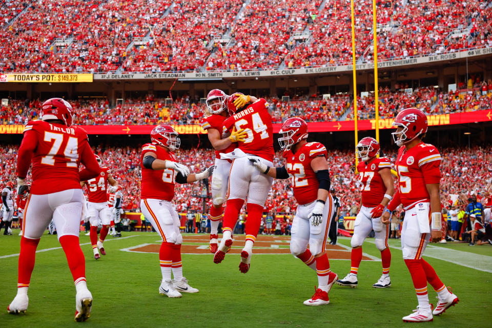 KANSAS CITY, MISSOURI – SEPTEMBER 15: Carson Steele #42 of the Kansas City Chiefs celebrates with Wanya Morris #64 of the Kansas City Chiefs after Morris' touchdown catch in the third quarter against the Cincinnati Bengals at GEHA Field at Arrowhead Stadium on September 15, 2024 in Kansas City, Missouri. (Photo by David Eulitt/Getty Images)