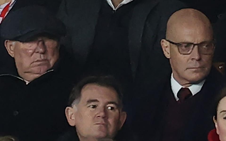 Sir Alex Ferguson and Sir Dave Brailsford watch from the directors box during the Premier League match between Nottingham Forest and Manchester United at the City Ground on December 30, 2023