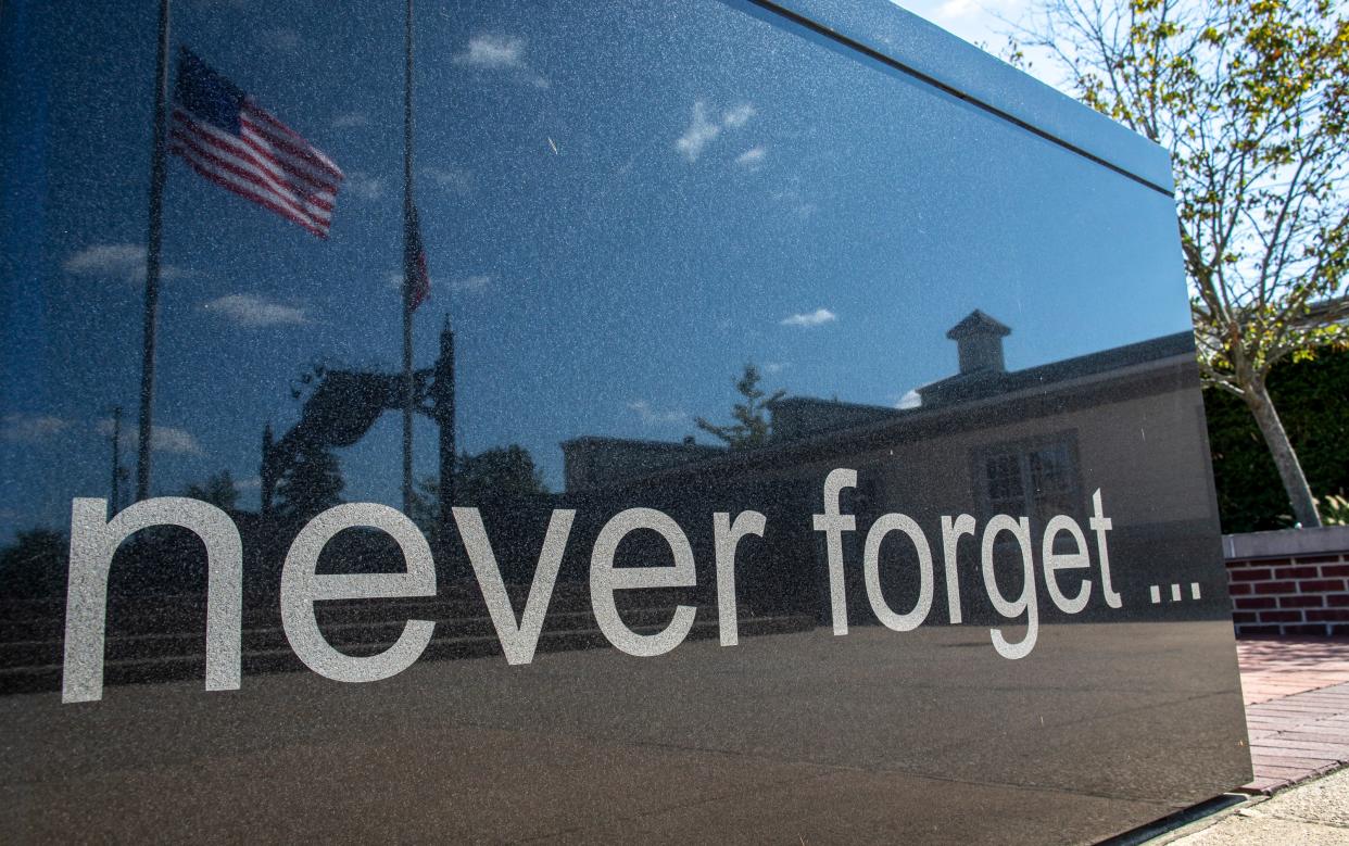 The American flag flies over 9/11 memorials at First Responders Park in Hilliard.