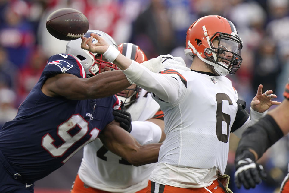 New England Patriots defensive end Deatrich Wise (91) forces Cleveland Browns quarterback Baker Mayfield (6) to fumble during the first half of an NFL football game, Sunday, Nov. 14, 2021, in Foxborough, Mass. (AP Photo/Steven Senne)