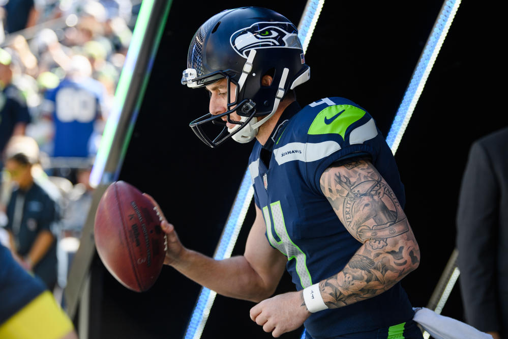 Seattle Seahawks punter Michael Dickson (4) wears an international flag  decal and a Crucial Catch logo on his helmet during an NFL football game  against the New Orleans Saints, Sunday, Oct. 9