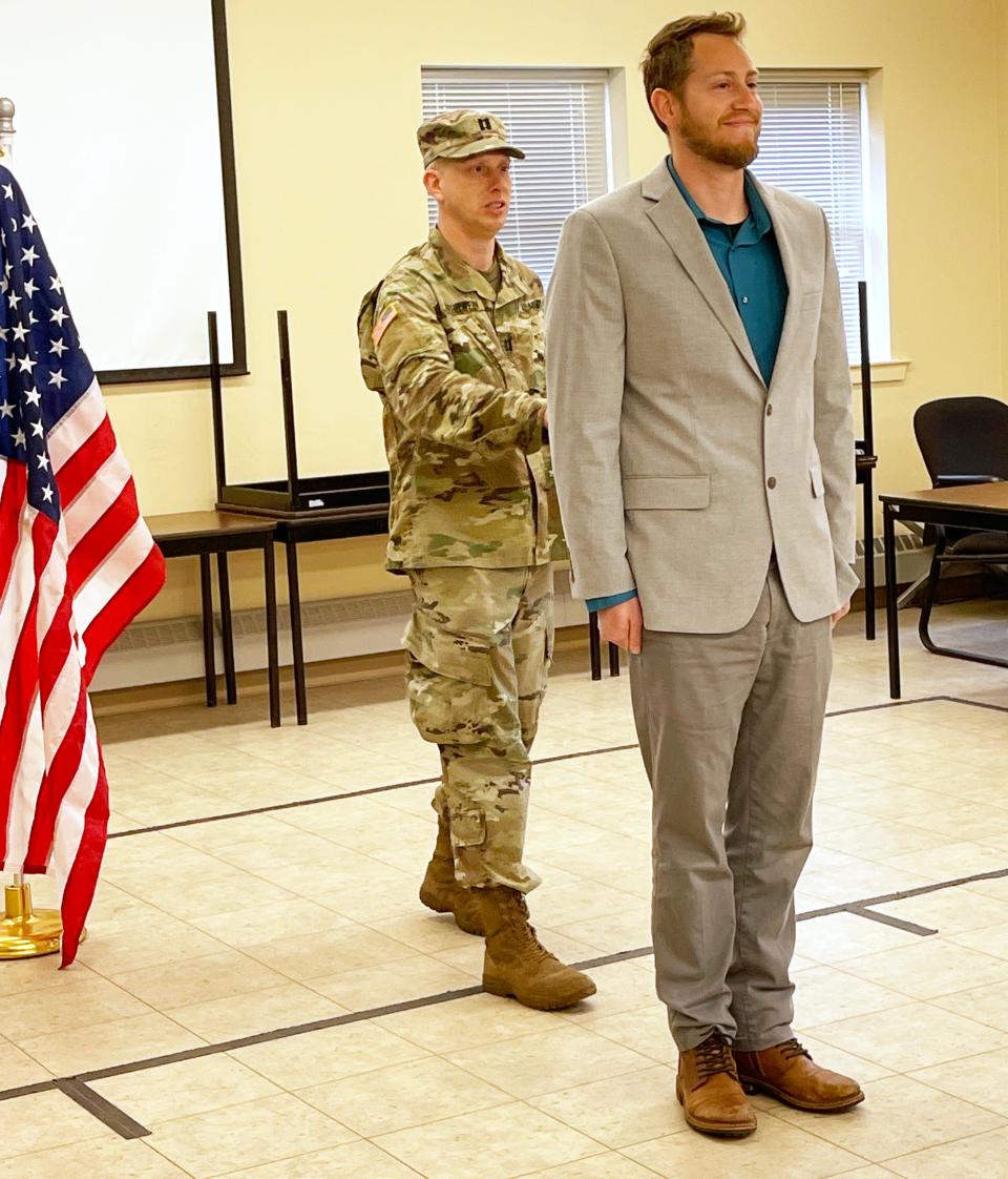 US Army Reserve Captain Blake Ruehrwein is sworn in during a ceremony at the Army National Guard Armory in Rehoboth on April 9, 2022.