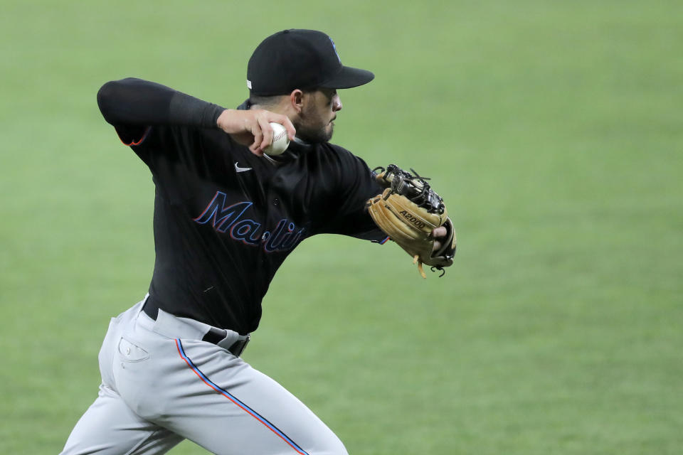 Miami Marlins third baseman Eddy Alvarez throws out Baltimore Orioles' Anthony Santander at first base on a groundout during the third inning in the second game of a baseball doubleheader, Wednesday, Aug. 5, 2020, in Baltimore. Among the Marlins' roster replacements following their coronavirus outbreak was infielder Alvarez, a 2014 Olympic silver medalist in speedskating. (AP Photo/Julio Cortez)