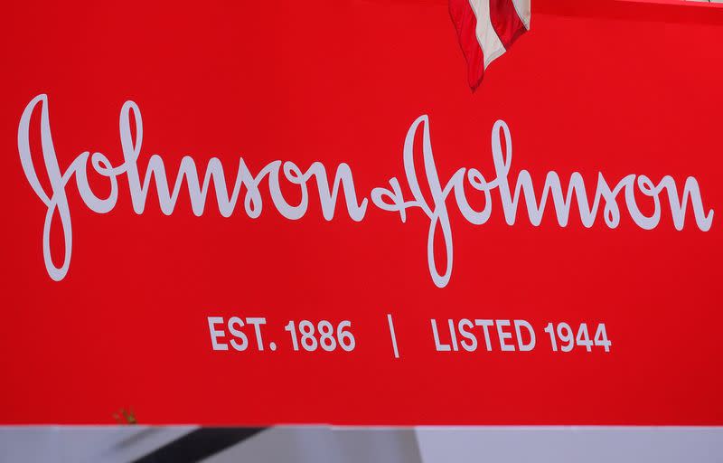 FILE PHOTO: The company logo for Johnson & Johnson is displayed to celebrate the 75th anniversary of the company's listing at the NYSE in New York