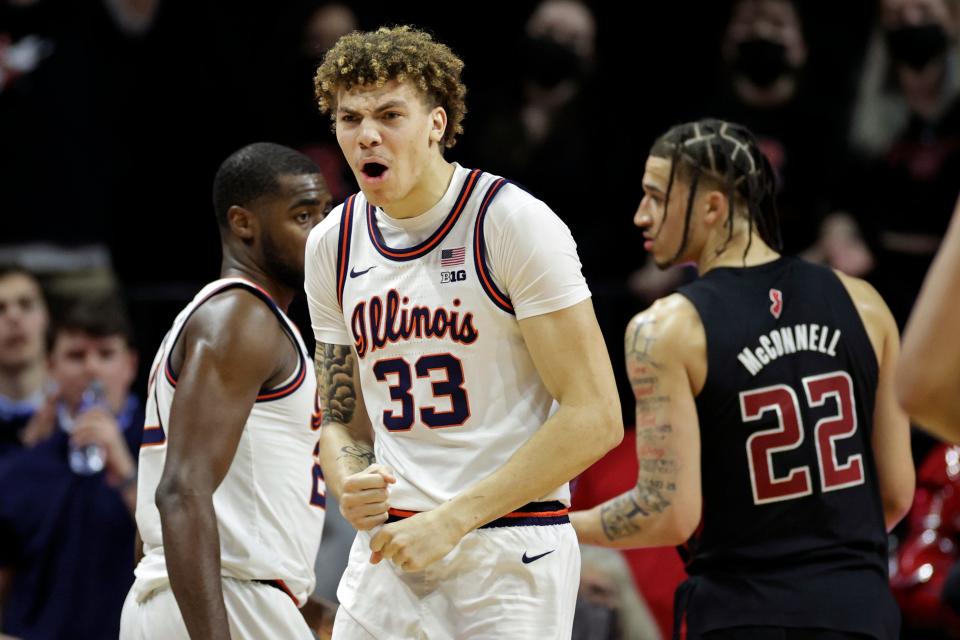 Illinois forward Coleman Hawkins (33) reacts during the second half of the team's NCAA college basketball game against Rutgers on Wednesday, Feb. 16, 2022, in Piscataway, N.J. (AP Photo/Adam Hunger)