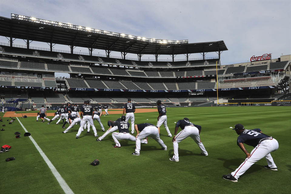 The Atlanta Braves stretch as the team holds their first workout in their new baseball stadium Thursday, March 30, 2017, at SunTrust Park in Atlanta. Curtis Compton/Atlanta Journal-Constitution via AP)
