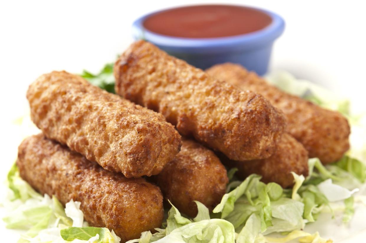 fried mozarella sticks on white background