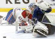 Montreal Canadiens right wing Paul Byron (41) fails to get a shot past Vancouver Canucks goaltender Thatcher Demko (35) during first-period NHL hockey game action in Vancouver, British Columbia, Monday, March 8, 2021. (Jonathan Hayward/The Canadian Press via AP)