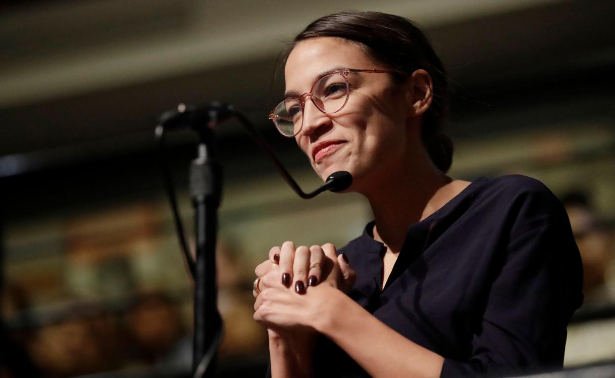 Democrat Alexandria Ocasio-Cortez asks 2014 Nobel Laureate Malala Yousafzai a question at the Kennedy School's Institute of Politics at Harvard University in Cambridge, Mass., on Dec. 6, 2018.