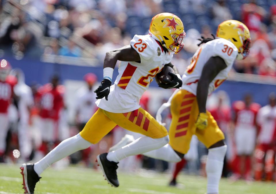 Stars cornerback Mazzi Wilkins (23) returns an interception as linebacker Jordan Moore (30) looks to block ahead of him duriing their USFL semifinal win at Tom Benson Hall of Fame Stadium, Saturday , June 25, 2022.