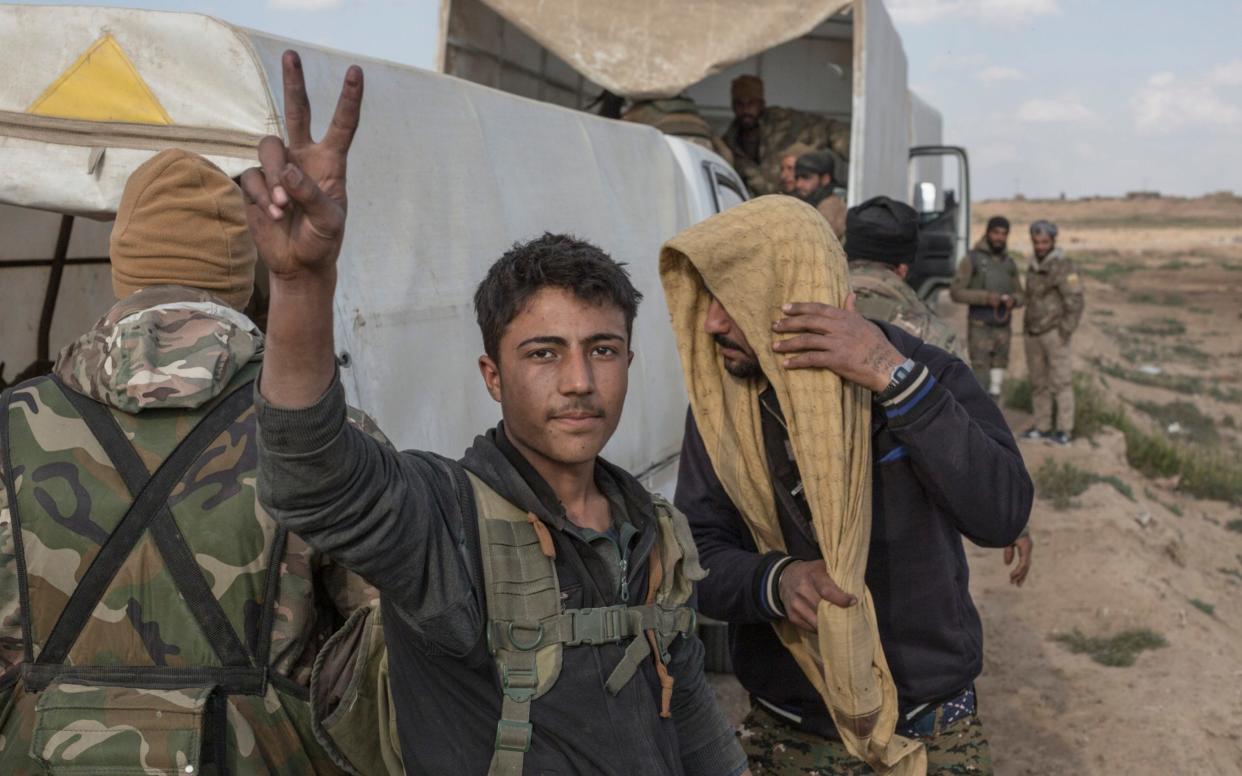 Syrian Democratic Forces soldiers fighting ISIL return from the frontline in Baghuz - The Telegraph