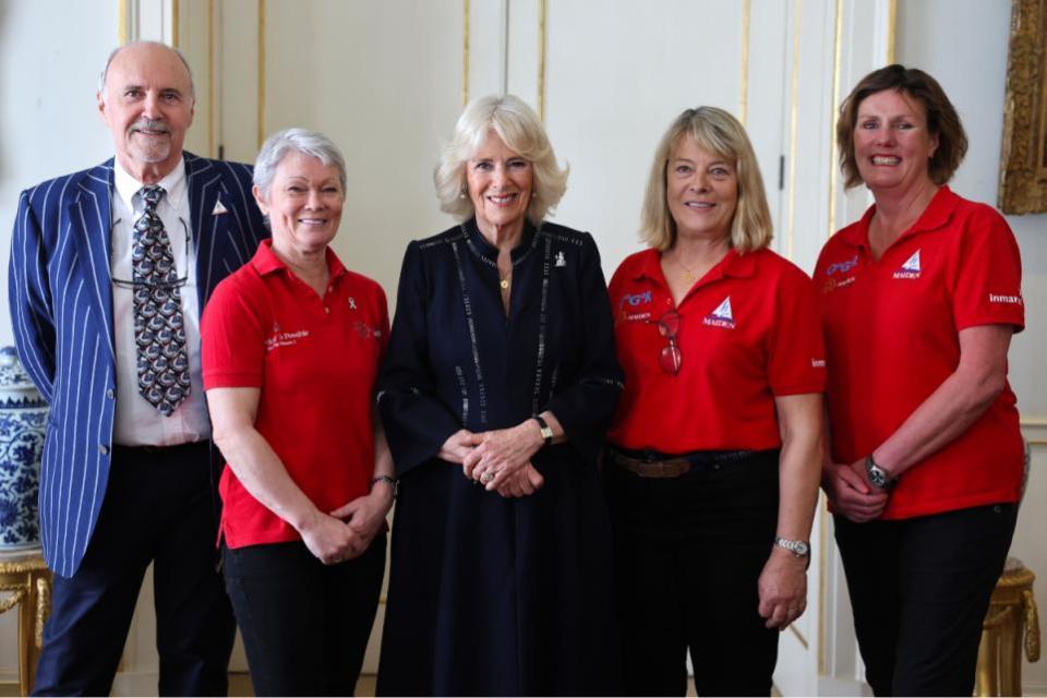 Isle of Wight County Press: Queen Camilla with crew members as she hosts a reception for the 'Maiden' yachting crew, at Clarence House in London