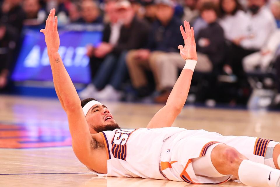 Devin Booker #1 of the Phoenix Suns reacts on the court during the first half against the New York Knicks at Madison Square Garden on Nov. 26, 2023, in New York City, New York.