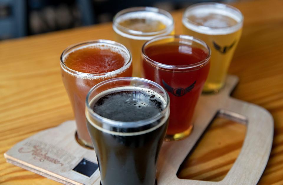 A flight features, from front to back, Mississippi Ale House Coffee Style, Mississippi Ale House Arm Chair Amber, Backwater Elderberry Cider,  Mississippi Ale House Light and Top of the 'Sip Pilsner on Thursday, June 30, 2022, at Mississippi Ale House in Olive Branch. 