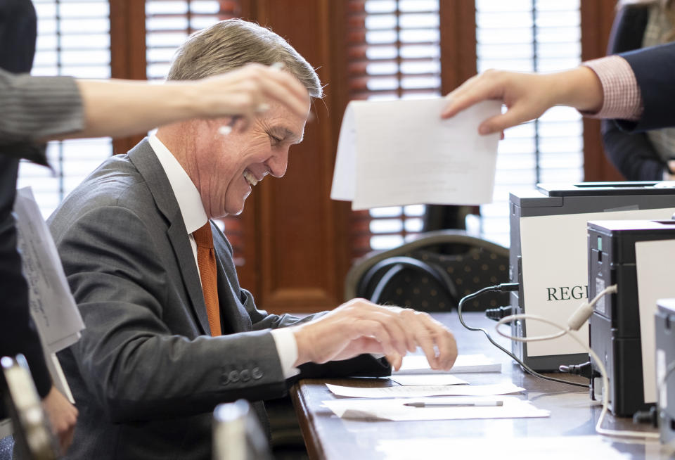 Former U.S. Sen. David Perdue files paperwork to qualify to run for governor Wednesday, March 9, 2022 at the Georgia State Capitol in Atlanta. (Ben Gray/Atlanta Journal-Constitution via AP)